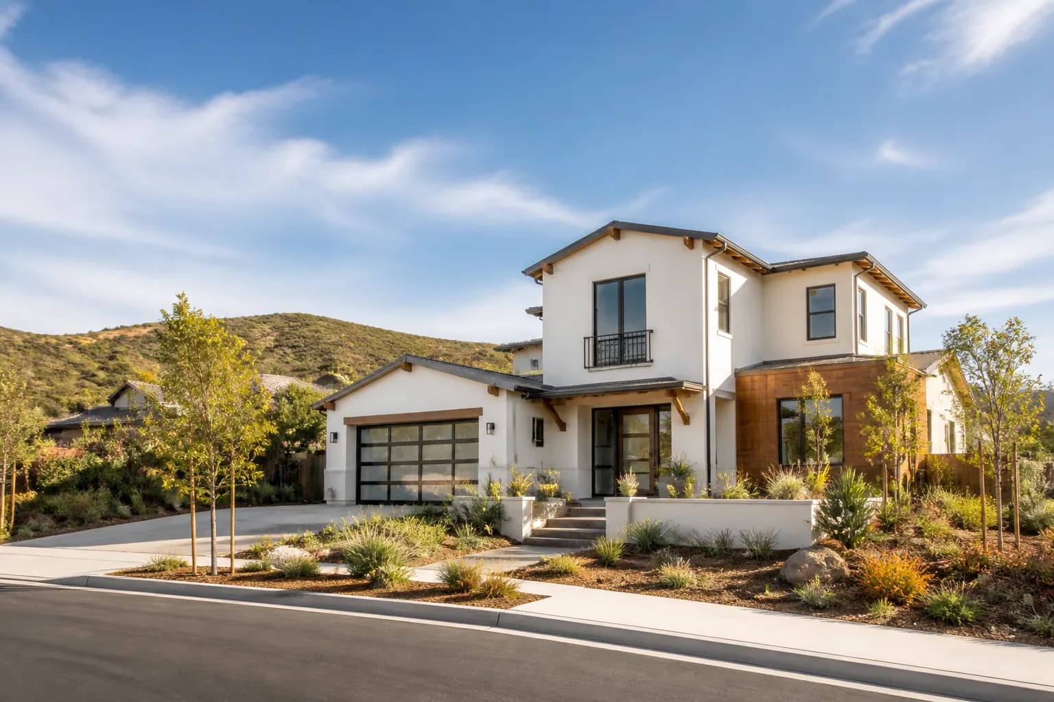Illustrative newer California home with drought-tolerant landscaping and nearby hills, inspired by Carmel Valley.